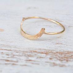 Super cute and dainty gold filled hammered open arc ring.Minimalist ring- great to stack with other.Beautiful handmade ring , great as a gift.Modern minimalist and beautiful item.Delicate and simple for everyday.You can combine stacking with this allipse ring:http://etsy.me/2dFw1sMMade from 100% gold filled.All my jewelry are packed in an elegant gift box.If you want to give it as a gift you can specify the address and I'll be happy to send it on your behalf.More rings:https://www.etsy.com/listi Dainty Hammered Rings, Dainty Hammered Stackable Open Rings, Dainty Hammered Open Stackable Rings, Dainty Hammered Open Midi Rings, Handmade Minimalist 14k Gold Filled Ring, Dainty Hammered Midi Rings As Gift, Handmade Minimalist 14k Gold Midi Rings, Minimalist Gold Ring, Jewelry Dainty