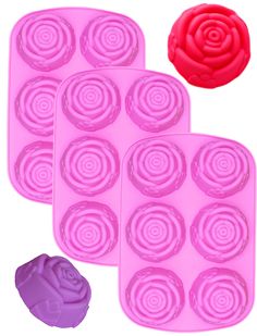 three pink rose shaped chocolate molds next to a purple cookie sheet with a flower on it