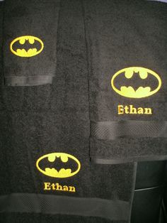 three towels with batman logos on them