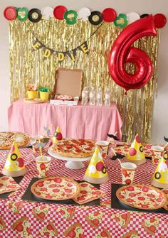 a birthday party with pizza and balloons