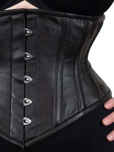 The CS-201 waspie steel boned plus size waist trainer combines a shorter profile with super cinching! This soft supple lambskin corset is easily our most comfortable style to wear. This short corset is so comfortable you may forget you have it on-except everyone will notice your fabulous cinched waist! Closed waist sizes 34-40. Smaller sizes available. We recommend that you wear something between yourself and the corset and lucky you, we have a bamboo liner that will do just that! Buy one or sav Classic Black Fitted Corset, Classic Fitted Black Corset, Fitted Underbust Leather Corset, Fitted Leather Overbust Corset, Fitted Leather Underbust Corset, Fitted Leather Corset With Corset Back, Gothic Fitted Leather Corset, Gothic Leather Fitted Corset, Fitted Gothic Leather Corset