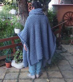 Gray Chunky Knit Poncho, Oversized Knit Sweater, Poncho Sweater Long Giant handmade knitted cardigan-poncho. This chunky knit poncho- cardigan is oversized, very soft, super warm . As it is oversized you can wrap yourself in it like in a blanket and feel cozy, stay warm and look awesome and stylish. Match it with different clothes, shoes as well as textures and enjoy every outfit! Fully handmade. The poncho can be worn on both sides so you have two different knits. On cold winter days, you can u Oversized Hand Knitted Acrylic Knitting Pattern, Cozy Oversized Acrylic Knitting Pattern, Oversized Cozy Acrylic Knitting Pattern, Cozy Hand Knitted Winter Poncho, Winter Knitted Poncho Cape, Cozy Hand-knitted Winter Poncho, Gray Oversized Poncho For Winter, Oversized Knit Winter Cape, Winter Knitted Cape Poncho