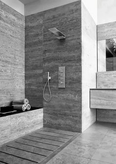 a modern bathroom with wooden flooring and walls