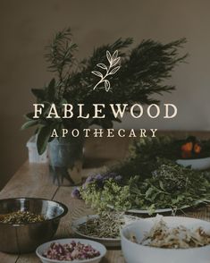 the table is covered in bowls and herbs