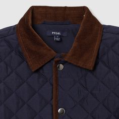 The Henry Quilted Jacket is the perfect winter coat for boys seeking warmth without the bulk. Featuring a classic diamond quilting pattern, this jacket offers both insulating warmth and style. The snap button closures and soft corduroy collar add functional yet fashionable details, making it an essential piece for colder months. Whether for outdoor play, school commutes, or everyday wear, this durable jacket keeps your little one warm and dry in the winter season. Key Features: Diamond quilting Quilted Workwear Jacket With Button Closure, Fall Quilted Button-up Outerwear, Quilted Boys Shirt, Winter Quilted Button-up Jacket With Snap Buttons, Winter Button-up Cotton Quilted Jacket, Quilting Easy, Polo Tees, Quilted Jacket, Short Pants