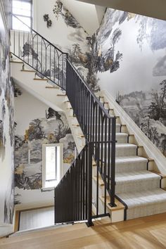 the stairs are painted with black and white wallpaper