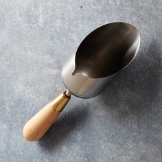 a wooden spoon sitting on top of a gray counter