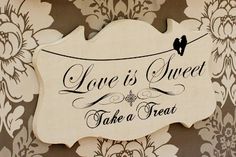 a sign that says love is sweet take a treat