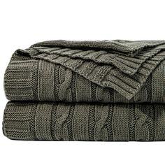 two blankets folded on top of each other with cable knits in grey and white