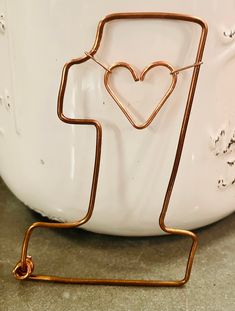 a heart shaped item on a metal holder