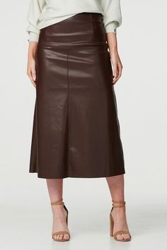 Add a trendy faux leather look to your skirt collection with this sleek midi. It has a high waist, fitted straight silhouette and a midi length hem. Pair with a tucked in blouse or long sleeve fitted top for a chic style you could wear for lunch out with friends or even a day at the office. Long Sleeve Fitted Top, Satin Outfits, Evening Trousers, High Waist Midi Skirt, Denim Wedding, Skirt Collection, Evening Skirts, Petite Jumpsuit, Sequin Outfit