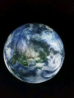 the earth as seen from space on a black background with no image to describe it