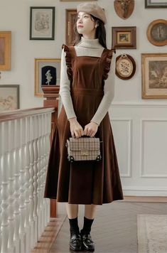 Classic apron pinafore dress with ruffled sides, a square neckline, self-tie waist sash side pockets, and pleated midi skirt. So cute to match with your favorite sweater. Lined. Concealed side zipper. S: 28" waist, 41" lengthM: 29.5" waist, 41" lengthL: 31" waist, 41" length