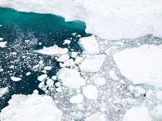 an aerial view of ice floes and water