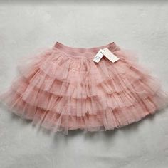 Brand: Gap X Love Shack Fancy Description: Kids Tulle Flippy Skirt In Pink Gap Icons Meet Loveshackfancy Icons.Classics With Florals, Nostalgic With A Twist, Made For All. Elasticized Waist. Tiered Layers Of Tulle Lined #799316 Hits Above The Knee. 100% Nylon Lining 100% Modal Machine Wash Gentle, Inside Out Imported. Sizes Available: Girl's (S (6-7)) 58356, (M (8)) 58458, (Xl (12)) 58362 Pink Ruffle Skirt, Fancy Skirts, Hi Low Skirts, Love Shack Fancy, Skirts For Kids, Pink And Purple Flowers, Girls Tie, Pink Tulle, Pink Ruffle