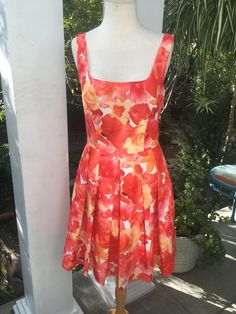 "A figure flattering fit 'n flair deep square neck 1990's style summer dress in a gorgeous orange and blood orange floral fabric print by Georgio Studio. It looks like you're wearing a gorgeous painting. Size 6 Petite or M - note: it is pictured here on a size small mannequin -- when properly filled out - this dress is stunning and so flattering.  14 1/2\" waist measured flat across 29\" length" Cheap Orange Floral Print Dresses, Style Summer Dress, Bright Floral Dress, Small Mannequin, Orange Floral Dress, 1990s Fashion, Floral Print Fabric, Fabric Print, 50s Fashion