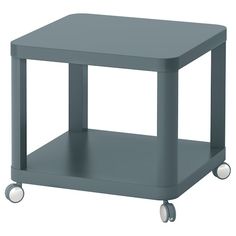 a small gray table with wheels on it