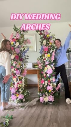 two women standing next to each other in front of a floral arch that says diywedding arches