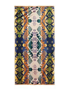 an orange, blue and yellow rug with geometric designs on it's edges is featured against a white background