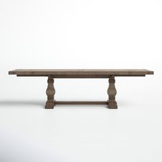 a wooden table sitting on top of a white floor