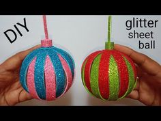 two handmade ornaments with glitter on them, one in the shape of a ball