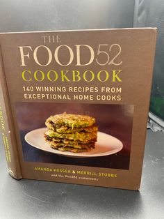 the food52 cookbook is sitting on a table