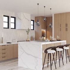 a kitchen with marble counter tops and bar stools