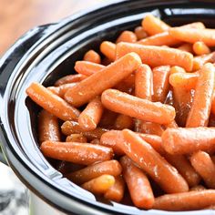 there are carrots in the slow cooker and it is ready to be cooked