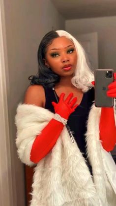 a woman dressed as santa clause taking a selfie