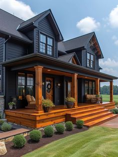 a large black house with lots of windows