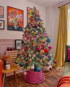 a brightly colored christmas tree in a living room