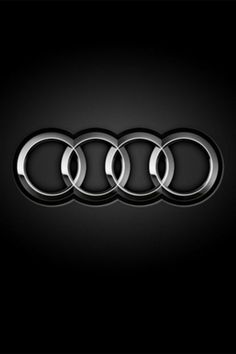 an audi logo on a black background with the word's symbol in the middle