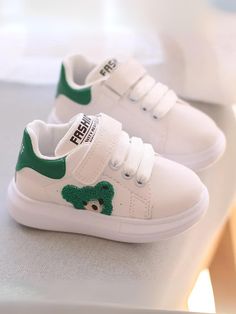 These adorable sneakers are perfect for your little one's active lifestyle. 	Designed with a playful teddy bear detail, these shoes are both stylish and fun. 	The comfortable fit and durable construction ensure your child can run and play with ease. 	Available in three charming colors: Green, Beige, and Black. 	These sneakers will quickly become a favorite in any wardrobe. Beige And Black, Colors Green, Green Beige, Girls Bags, Girls Fashion, Active Lifestyle, Beige Color, Girl Fashion, Comfort Fit