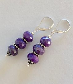 "Lovely silver coated purple chalcedony gemstone dangle earrings with fine silver and Sterling silver accents. Gorgeous and sparkly 9mm faceted silver coated purple chalcedony gemstones wire wrapped with rhodium plated pewter bead caps and fine silver daisies on Sterling silver lever back earrings. Total drop is 1 3/4\". Matching purple chalcedony bracelet also available in my shop. Please see last photo above. This listing for earrings only. Makes a beautiful Mother's Day gift set!" Beaded Ornaments Diy, Chalcedony Bracelet, Purple Chalcedony, Chalcedony Earrings, Diy Jewelry Unique, Aquamarine Earrings, Making Earrings, Silver Coat