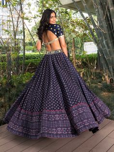 A three-piece Arshiya Navy Blue lehenga set from the Rashika Sharma collection. This beautiful navy blue printed lehenga in chiffon fabric is paired with a hand-embroidered cotton silk blouse. The lehenga features an embroidered belt detail at the waistline. And the blouse has a cut out back with mirror work. The outfit is completed with an embroidered net dupatta. The nakshi, pechani, zardozi, sequins, mirror and resham work enhance the Arshiya Navy Blue lehenga set.
Potli Bag NOT included.
Rea Navy Blue Lehenga, Chaniya Choli Designs, Choli Dress, Printed Lehenga, Cotton Blouse Design, Simple Lehenga, Cotton Lehenga, Wedding Lehenga Designs, Lehenga Designs Simple