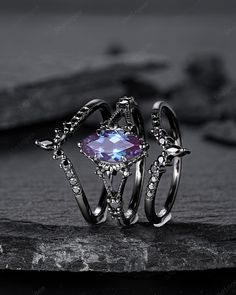 Rhodium black engagement ring like no other. This AMAZING piece of fine jewelry is the perfect expression of your eternal love. Its BLACK colors bring out the beauty of this ring. Alexandrite is the gemstone of luck, prosperity, and intellect. The alexandrite gemstone shines different colors in different lights. Under white light it shines more green and shines purple and blue under yellow light and daylight. More black gold rings ,please click here: https://www.etsy.com/shop/ShainGem?section_id Alexandrite Ring And Black, Gothic Black Crystal Promise Ring, Gothic Black Promise Rings, Gothic Black Promise Jewelry, Gothic Open Ring Jewelry For Anniversary, Black Open Ring Jewelry For Promise, Black Open Ring For Promise, Gothic Promise Ring Jewelry, Gothic Gemstone Jewelry For Promise Ring