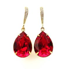 "Brighten up your mood instantly with this elegant and sparkly Swarovski Dark Red Jewelry Set! These dazzling fancy crystals are designed with incredible facets that produce the famous Swarovski sparkle. Earrings and Necklace Jewelry Set made with: - the gorgeous and Genuine 18x13mm Siam Swarovski teardrop pear shaped fancy stones, set in sterling silver plated settings - Hypoallergenic Rhodium plated rhinestone ear hooks - the earrings are about 1 1/2\" top of the ear wire to bottom of the ston Dazzling Red Earrings For Formal Occasions, Valentine's Day Formal Crystal Earrings, Red Jeweled Earrings For Evening, Red Jeweled Crystal Drop Earrings, Red Crystal Earrings For Gift, Red Sparkly Jewelry For Formal Occasions, Red Crystal Drop Earrings, Red Bling Jewelry For Evening, Glamorous Red Jewelry With Sparkling Stones