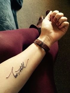 a woman's arm with a tattoo that says beautiful on the left side of her arm