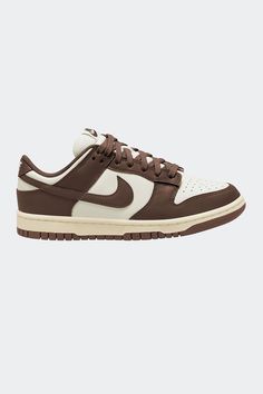 The vintage baller-style returns in a fresh new colourway, contrasting chocolate brown and and creamy white. The Nike Dunk Low sneakers are crafted from a crisp leather upper complimented with a foam insole, the Dunk Low offers reactive cushioning. Take your game anywhere, anytime - in style. Brown Panda Dunks, White And Brown Shoes, Nike Dunk Brown, Vintage Sneakers Retro, Brown Dunks, Sneakers Wishlist, Brown Panda, Trip Fits, Sneaker Closet