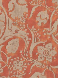 an orange and white floral design on fabric