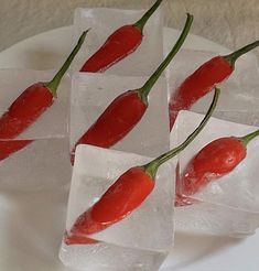 four pieces of ice with chili peppers on them