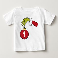 a white t - shirt with an image of a green bird on top of a red ornament