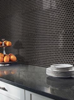 the kitchen counter is clean and ready to be used for breakfast or desserts, as well as oranges on plates