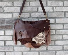 This bohemian bag is made of genuine  leather in dark brown. I use fringe details And you can pull out the fringe because they are attached with snap buttons.  The crochet is handmade. Large size. Closure is zipper. There are 1 zippered pocket inside and lined cotton fabric. Its  inner width is 37 and height is 27 cm. Thickness is 7 cm. (14.5'' x10.7'' x 2.8'' ) Strap is adjustable. Please note that color may vary according to monitor color calibrations. If you have any question, please don't he Boho Bag Crochet, Jean Bag, Large Crossbody Bag, Bohemian Bag, Brown Crochet, Large Crossbody Bags, Bohemian Bags, Jeans Bag, Metal Accessories