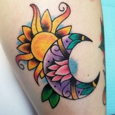 a sun and moon tattoo on the arm