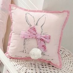 a pink pillow with a bunny on it