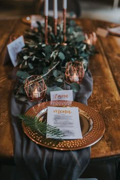 the table is set with candles and menus