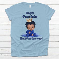 Baby Boy Blue Baby Shower Prince (or Baby) Custom Name On Shirts! Choose Shirt Color and Font Color. High-Quality Prints and Service These personalized Prince Shirts are adorable and will leave a lasting memory.  Pick name title in the listing options. If you would like additional names, contact me for additional payment options.   State the name of the coming prince, Shirt Color and family title in the box.  Please note: We will attempt to have the same brand for all of the shirts, however the supply shortage will  allow for different shirts to have different brands. We ONLY use premium SOFT SHIRTS! Blue Family Matching Tops For Father's Day, Family Matching Blue Pre-shrunk Shirt, Father's Day Blue Short Sleeve Tops, Blue Family Matching Shirt For Birthday, Family Matching Blue Shirt For Birthday, Family Matching Blue Shirt, Blue Pre-shrunk Shirt For Birthday, Blue Family Matching T-shirt For Gender Reveal, Blue T-shirt For Gender Reveal On Father's Day