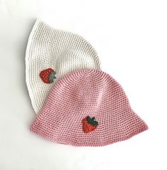 Beautiful, hand-crocheted bucket hat adorned with a strawberry applique.   A must have summer fashion accessory!  This light and breathable hat is made with 100% cotton. Hat should fit most teenagers and adults. Hat Circumference:  approximately 22 inches Hat Height: 9" from top to brim Hats are handmade and therefore may have natural imperfections. All products are lovingly created in a smoke-free and pet-free environment. Trendy Pink Bucket Hat For Summer, Playful Cotton Bucket Hat With Short Brim, Fun Cotton Hats For Spring, Cute Cotton Bucket Hat, Cute Sun Hat For Summer, Cute Summer Bucket Hat, Cute Summer Sun Hat, Casual Pink Bucket Hat For The Beach, Casual Pink Bucket Hat For Beach