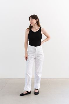 These workwear cotton pants feature the following: Zipper Fly, Metal Snap Closure, Belt Loops, Straight Leg, Two front pockets, two back pockets, side utility pockets. Great for studio work. Square shape - NARROW HIPS. Made for men originally. These have a tendency to loosen up a bit with wear. Bright White. Pre-Shrunk. Maker: Universal Chicago Stonecutter  | MADE IN USA | Material: 100% Cotton  Condition: Great. Washed Deadstock. May have a couple small marks from storage. Waist: 27"  |  Rise: Vintage Coveralls, Narrow Hips, Army Pants, Painters Pants, Vintage Tank Top, Vintage Tee Shirts, Vintage Flannel, Striped Jacket, Cotton Pants